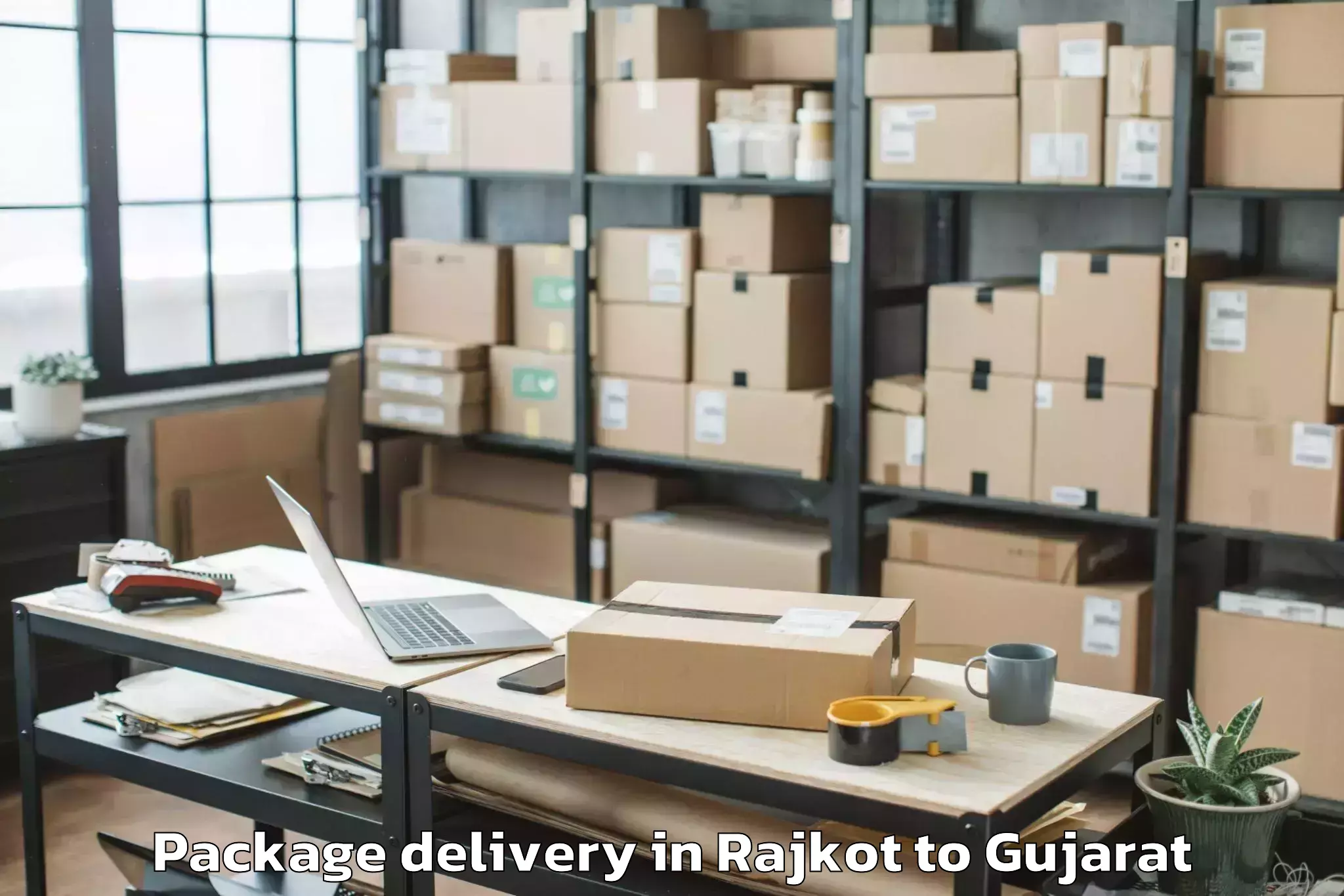 Top Rajkot to Navsari Agricultural Universit Package Delivery Available